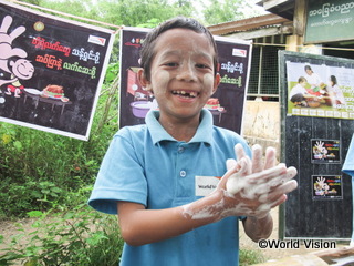 a boy participated in global hands washing day activity conductrd by WV (Myammer)